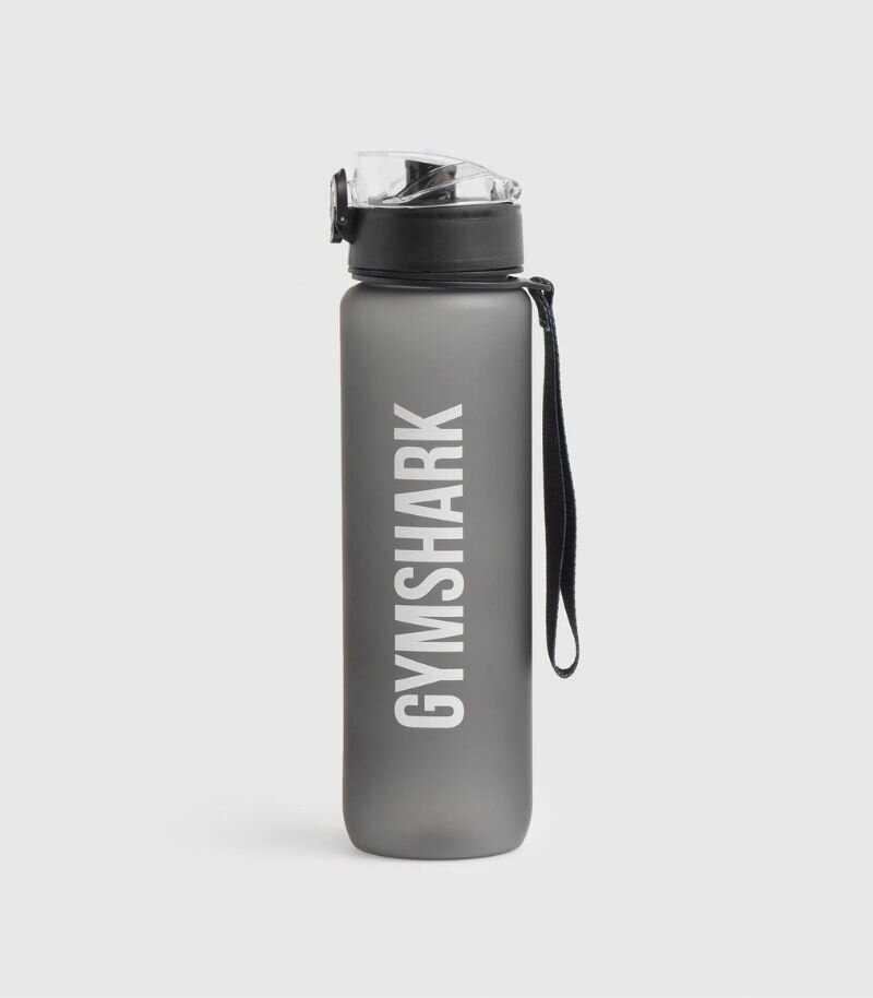 gymshark water bottle in grey with white branding and wrist strap